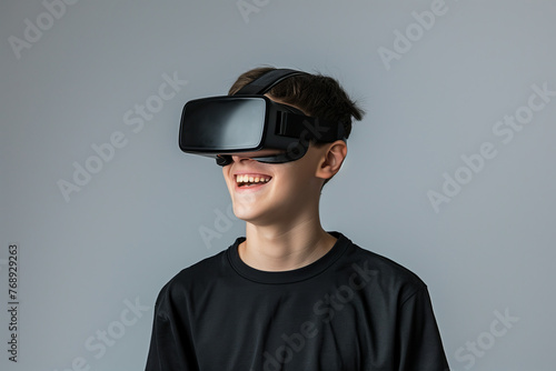Portrait of a man looking up with virtual reality glasses and light color background © Marcelo