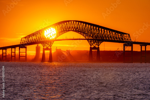 Sun Setting behind Francis Scott Key Bridge photo