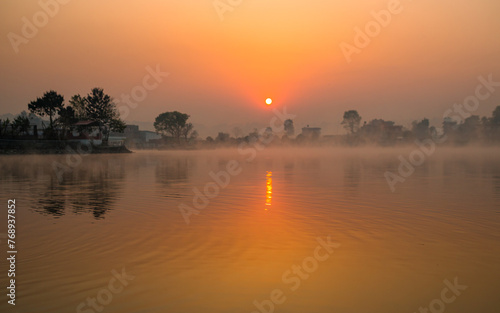 sunrise ovtravel, nature, asia, tourism, lake, river, water, gloomy, sunrise, sunset, sky, sun, ,er the Taudah lake in kathmandu, Nepal.