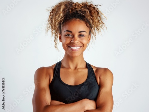 Portrait, fitness and arms crossed with happy black woman in studio on white background for health. Exercise, smile and workout with confident young sports model training for improvement