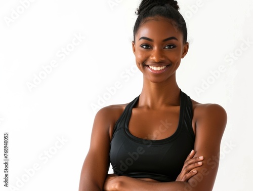 Portrait, fitness and arms crossed with happy black woman in studio on white background for health. Exercise, smile and workout with confident young sports model training for improvement