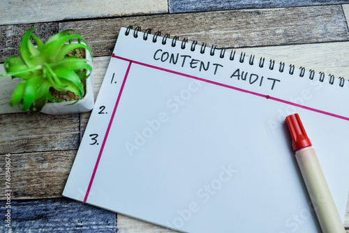 Concept of Content Audit write on book and Supported by an additional services isolated on Wooden Table.