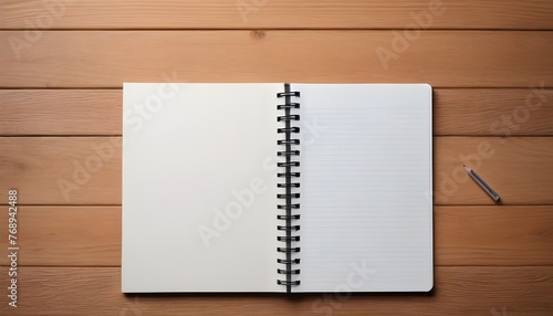 notebook and pen on wood