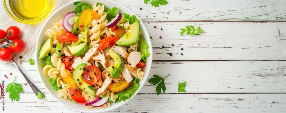 Fresh chicken meat with pasta salad, tomato and basil on white wooden board. Fresh chicken meat with pasta salad, tomato and basil on white wooden board.