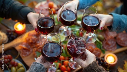 Friends Toasting Wine Over Cozy Dinner