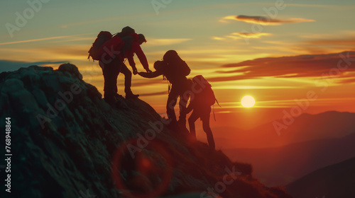 People helping each other reach the mountain top.