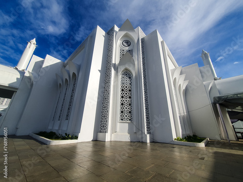 Beautiful mosque with minaret under the blue sky. Endan andansih mosque of Purwakarta, indonesia. Perfect for iedul fitri celebration background.  photo