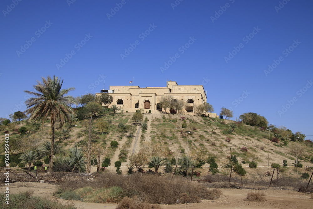 Fototapeta premium Saddam palace on hill in Babylon with blue sky