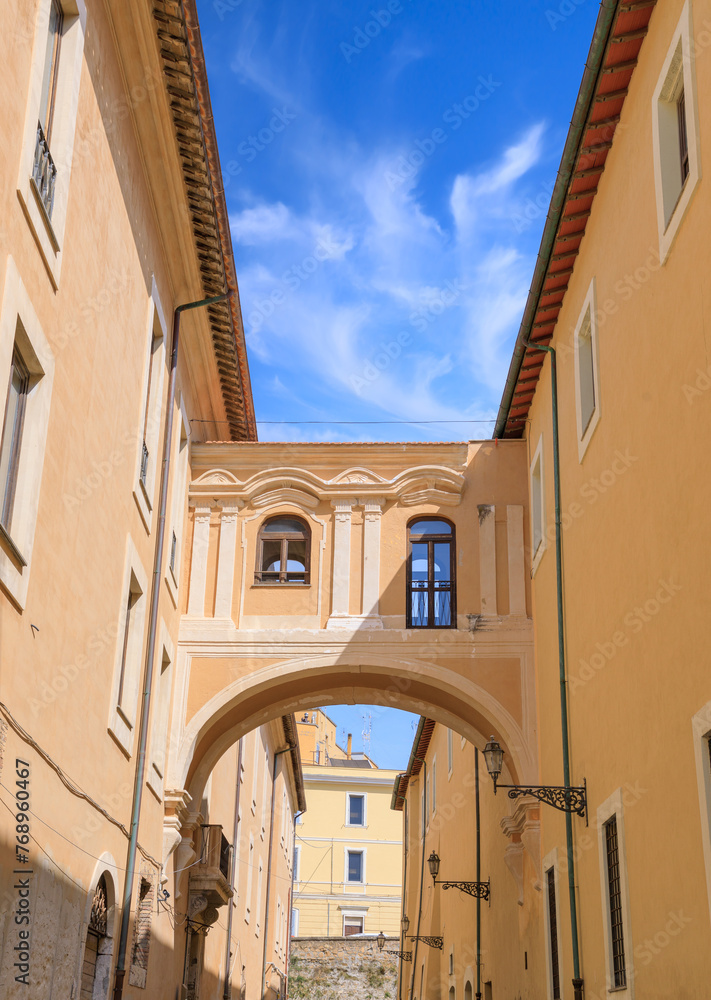 Historic center of Civitavecchia, Italy. View of the Old Hospital: the aerial passage that connects it between the two parts of the ancient hospital is suggestive.