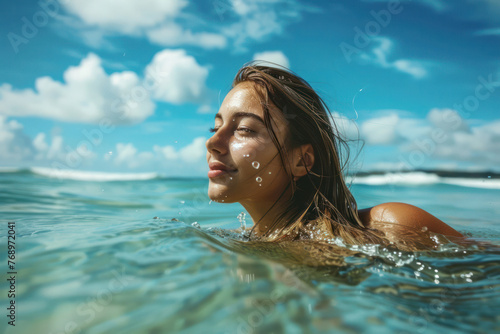 Woman Swimming in Ocean on Sunny Day