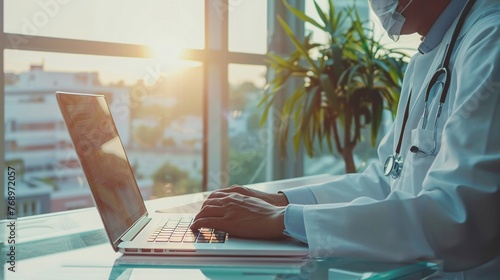 Doctor researching on a laptop in a sunlit office the face of contemporary healthcare photo
