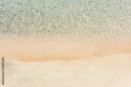Soft blue sea wave on clean sandy beach. Elafonisi Greece.