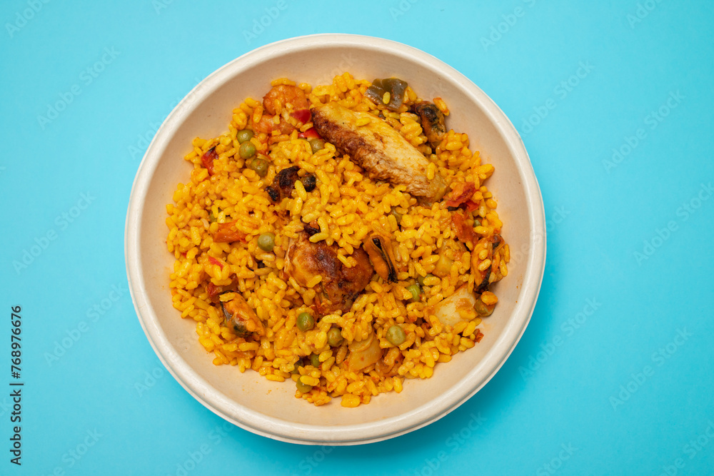 typicla spanish dish paella in plastic plate typicla spanish dish paella in plastic plate