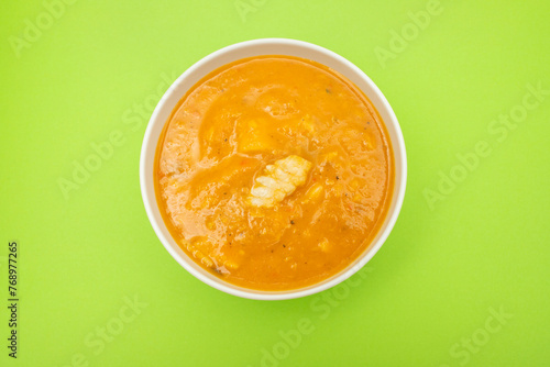 Creamy fish soup in bowl. Top view.