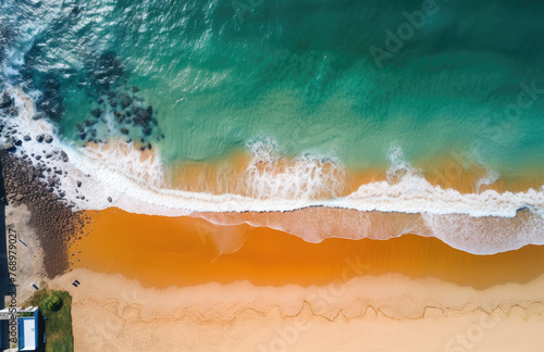 Beach and waves from top aerial view. Turquoise water background from top view. Summer seascape from air. Top view from drone. Travel concept and idea