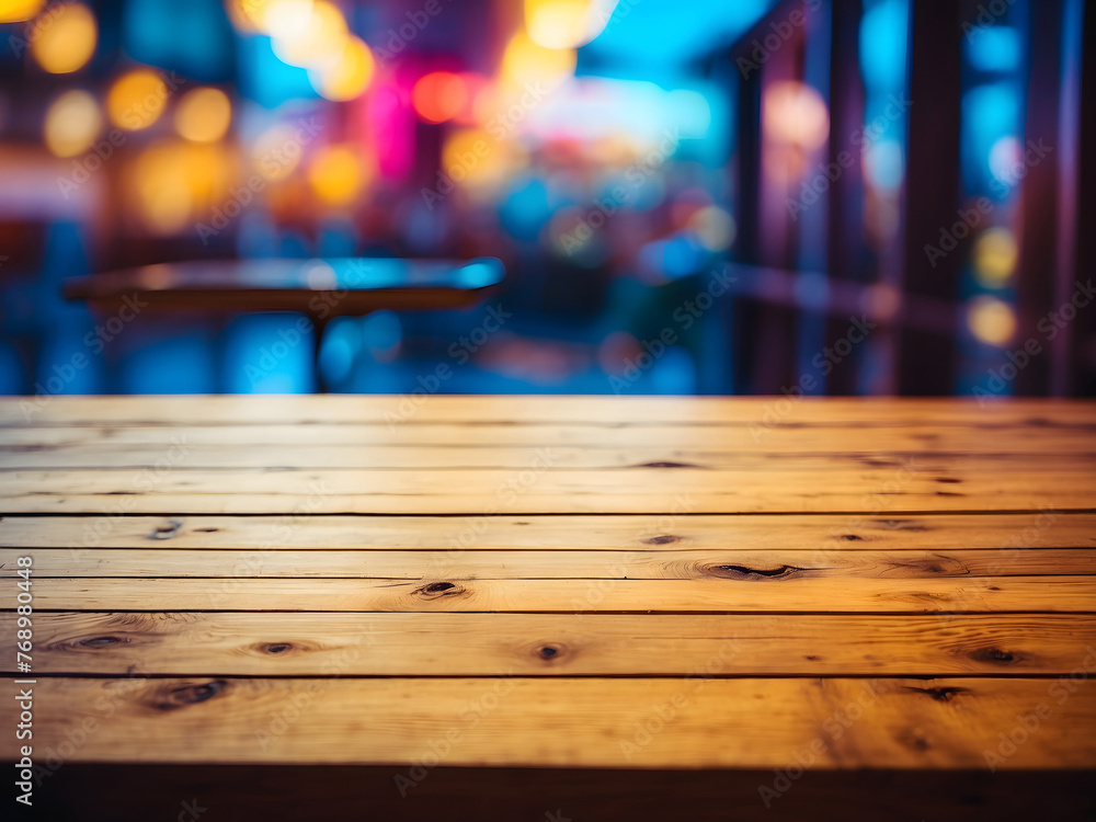 An empty wooden table top with a blurred background design.