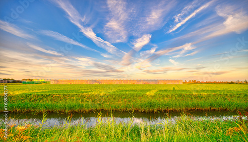 Clouds like rough brush strokes in the sky of rural Holland. photo