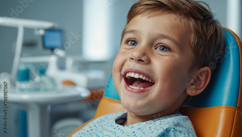 little boy happy in dental chair in clinic visit