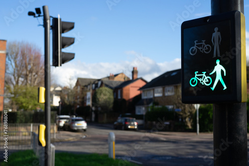 pedestrian crossing sign with green man and green cyclist