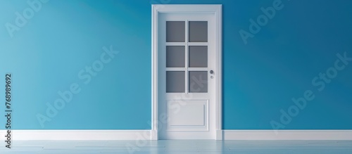 of a white isolated wooden door with three glass panes on a blue background.