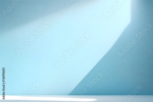 Minimal abstract simple light blue background for product presentation. Shadow and light from windows on plaster wall.