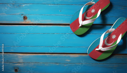 Pair of beach sandals with flag Azerbaijan. Slippers for summer sea vacation. Concept travel and vacation in Azerbaijan.