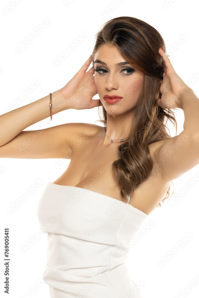 Portrait of gorgeous elegant sensual brunette woman wearing fashion white dress isolated on white background Portrait of gorgeous elegant sensual brunette woman wearing fashion white dress isolated on white background