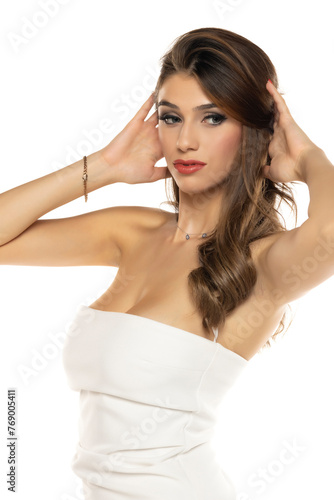 Portrait of gorgeous elegant sensual brunette woman wearing fashion white dress isolated on white background
