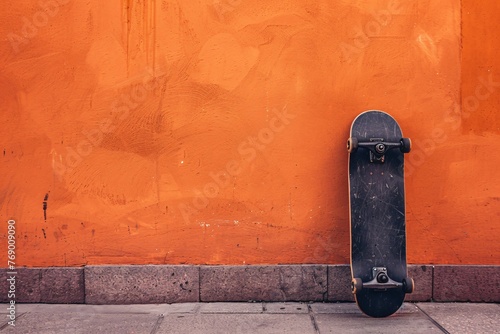 a skateboard leaning against a wall