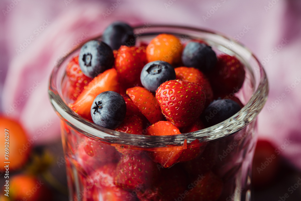 Ripe strawberry and blueberries in glass on the rustic background. Selective focus. Shallow depth of field.
Ripe strawberry and blueberries in glass on the rustic background. Selective focus. Shallow depth of field.