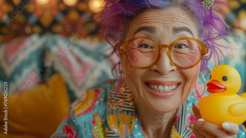 Senior woman with a rubber duck.