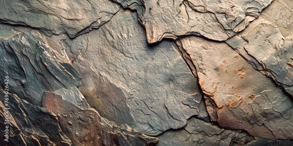 Dark slate texture background with delicate lighting to enhance surface details Dark slate texture background with delicate lighting to enhance surface details