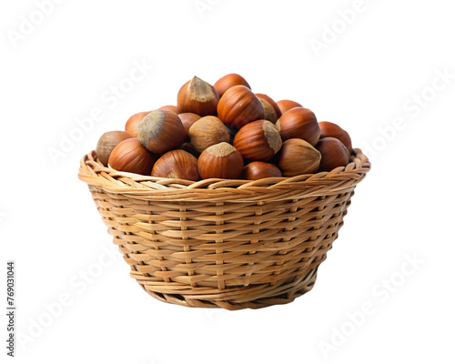 Hazelnuts in a wicker basket isolated on transparent background.