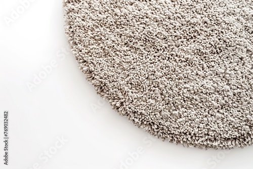 Plush grey rug on white background. Close up view. Home comfort and design aesthetics. Home textiles. Empty, copy space for text.