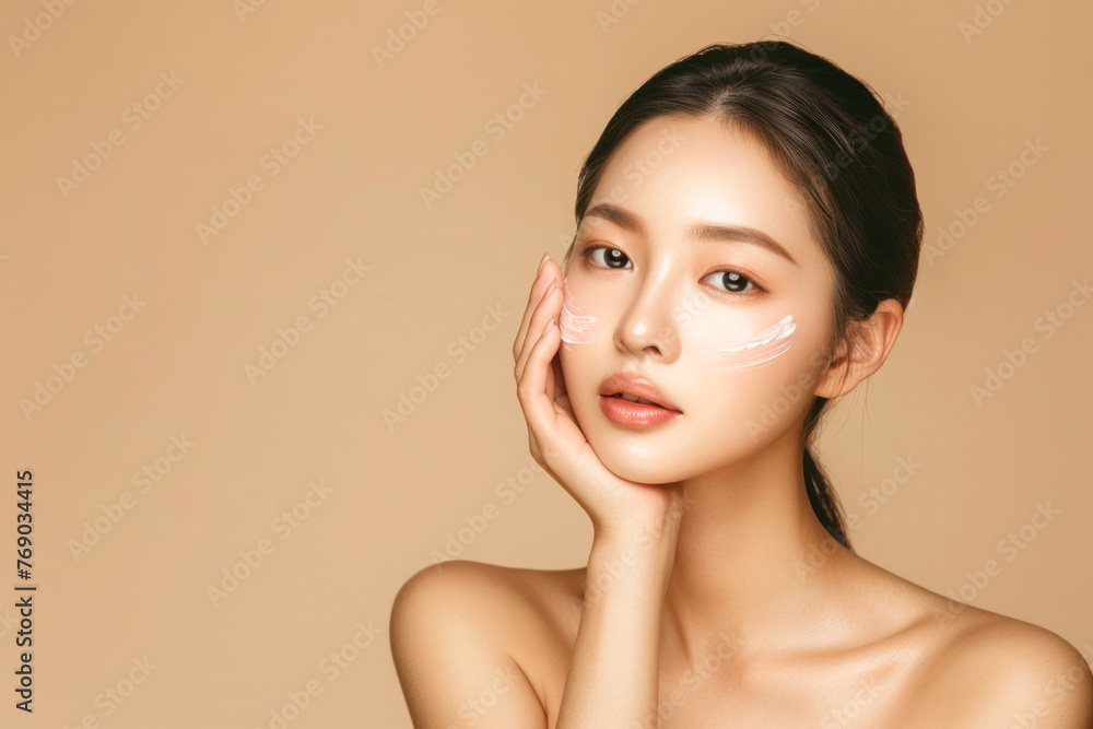 Beautiful young asian woman with clean fresh skin on beige background, Face care, Facial treatment, Cosmetology, beauty and spa, Asian women portrait