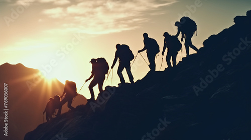 Group of people on peak mountain climbing helping team work