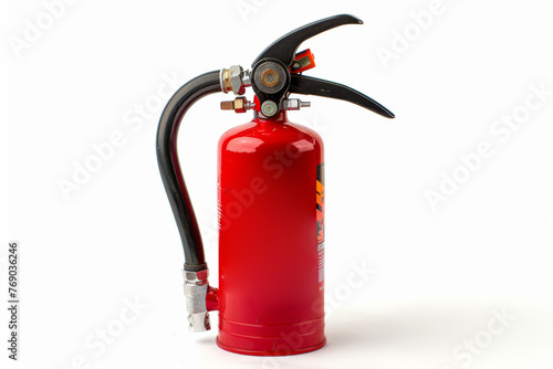 A red fire extinguisher stands on a white background photo