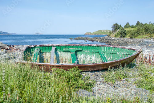 Abandoned fishing boat on a rocky Newfoundland beach.