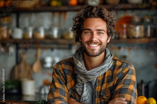 Handsome man with a beaming smile wearing a plaid shirt at a rustic café photo