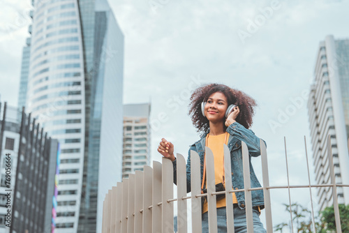 Happy joyful young tourist African American woman wearing headphones enjoy in the center of a city urban, Go Everywhere, Freedom