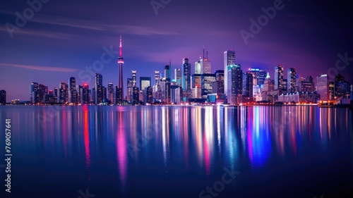 Illuminated skyline of Toronto over water - Vibrant panoramic night view of Toronto's illuminated skyline reflecting over calm waterfront, embodying urban life
