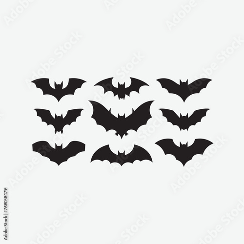 Black silhouettes of bats set on a white background vector art illustration