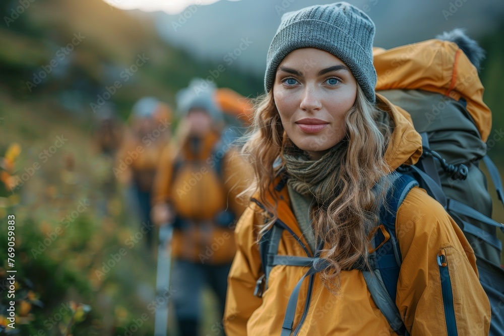 A young woman in warm clothing and a backpack leads her friends on a mountain hiking adventure, capturing the spirit of exploration and travel A young woman in warm clothing and a backpack leads her friends on a mountain hiking adventure, capturing the spirit of exploration and travel