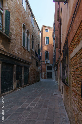 Townscape of a small narrow street with typical facades in Venice, Veneto, Italy © Sebastian