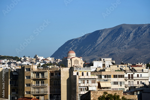 Roofs and balconies of houses and the dome of an Orthodox church in the city of Chania on the island of Crete