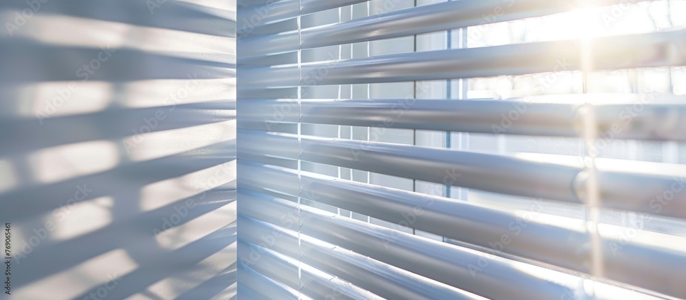 White blinds providing shade from sunlight. White blinds providing shade from sunlight.