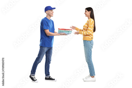 Dry-cleaning delivery. Courier giving folded clothes to woman on white background