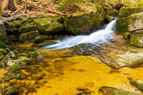 A beautiful view of a romantic stream in a wild mountain valley