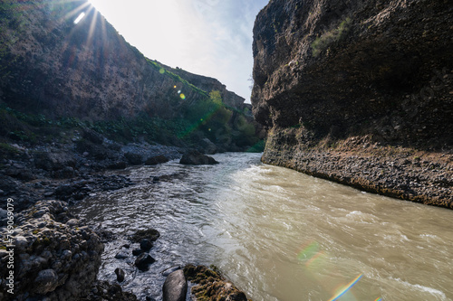 Aksu Canyon with a river in the mountains in Kazakhstan photo