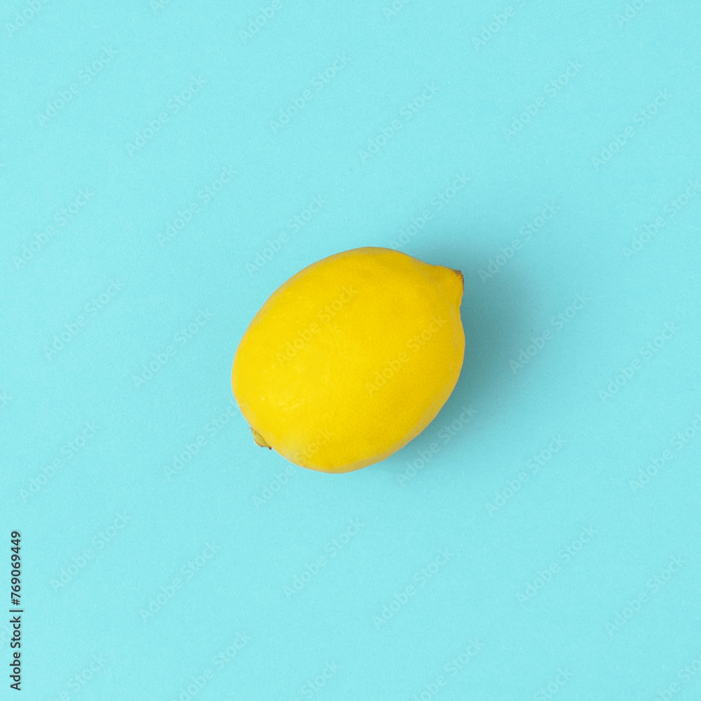 Fresh lemon on bright blue background. Minimal food concept. Fruit flat lay. Fresh lemon on bright blue background. Minimal food concept. Fruit flat lay.